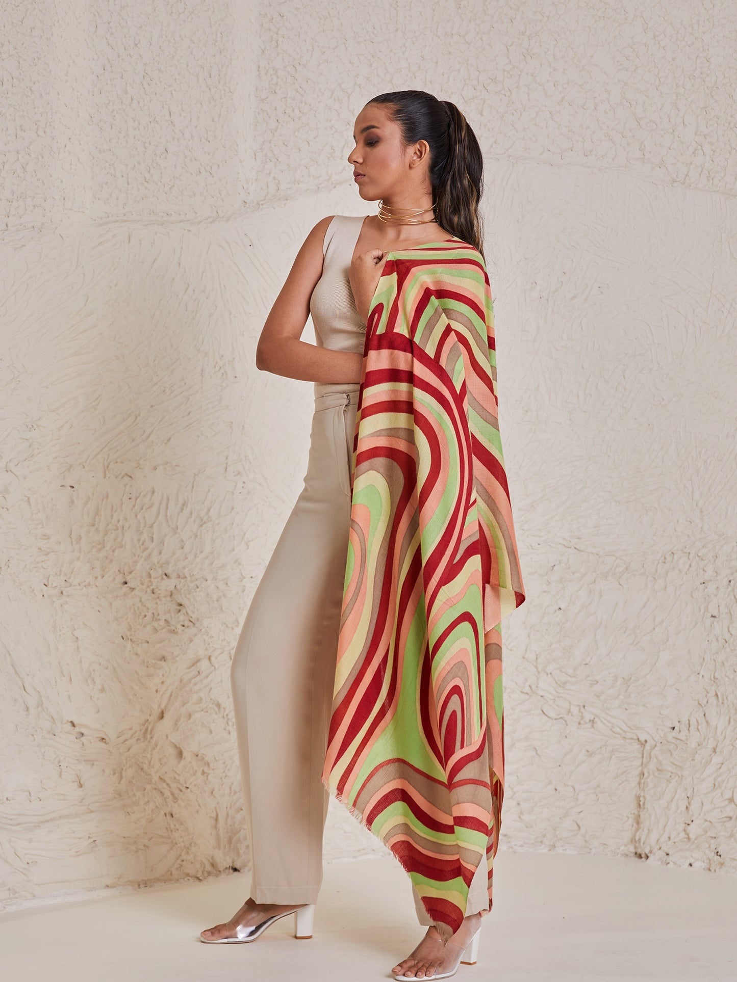 Model is wearing the disruption pashmina stole from shaza, handpainted in colours of green and red symbolizing  symphony.