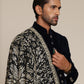 Man wearing a black pashmina shawl