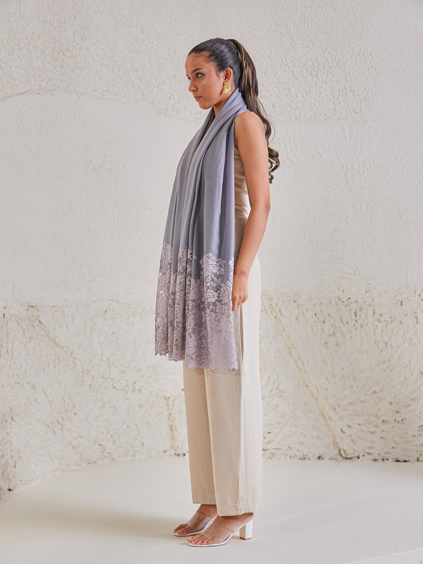 Model is wearing the Celestial Chantilly Pashmina Shawl in powder purple. 