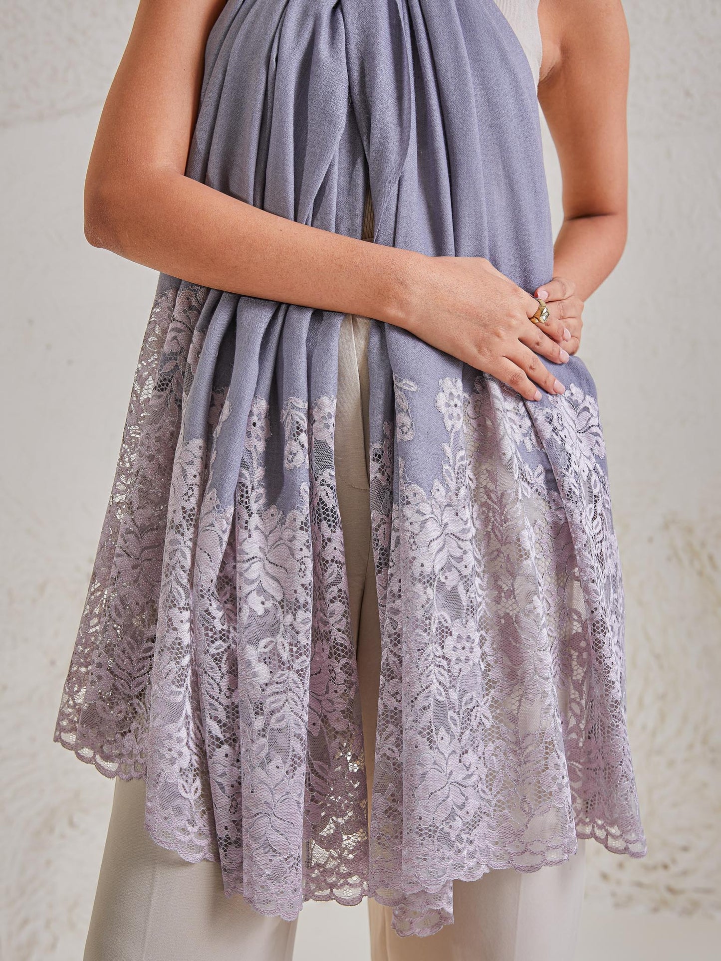 Model is wearing the Celestial Chantilly Pashmina Shawl in powder purple. 