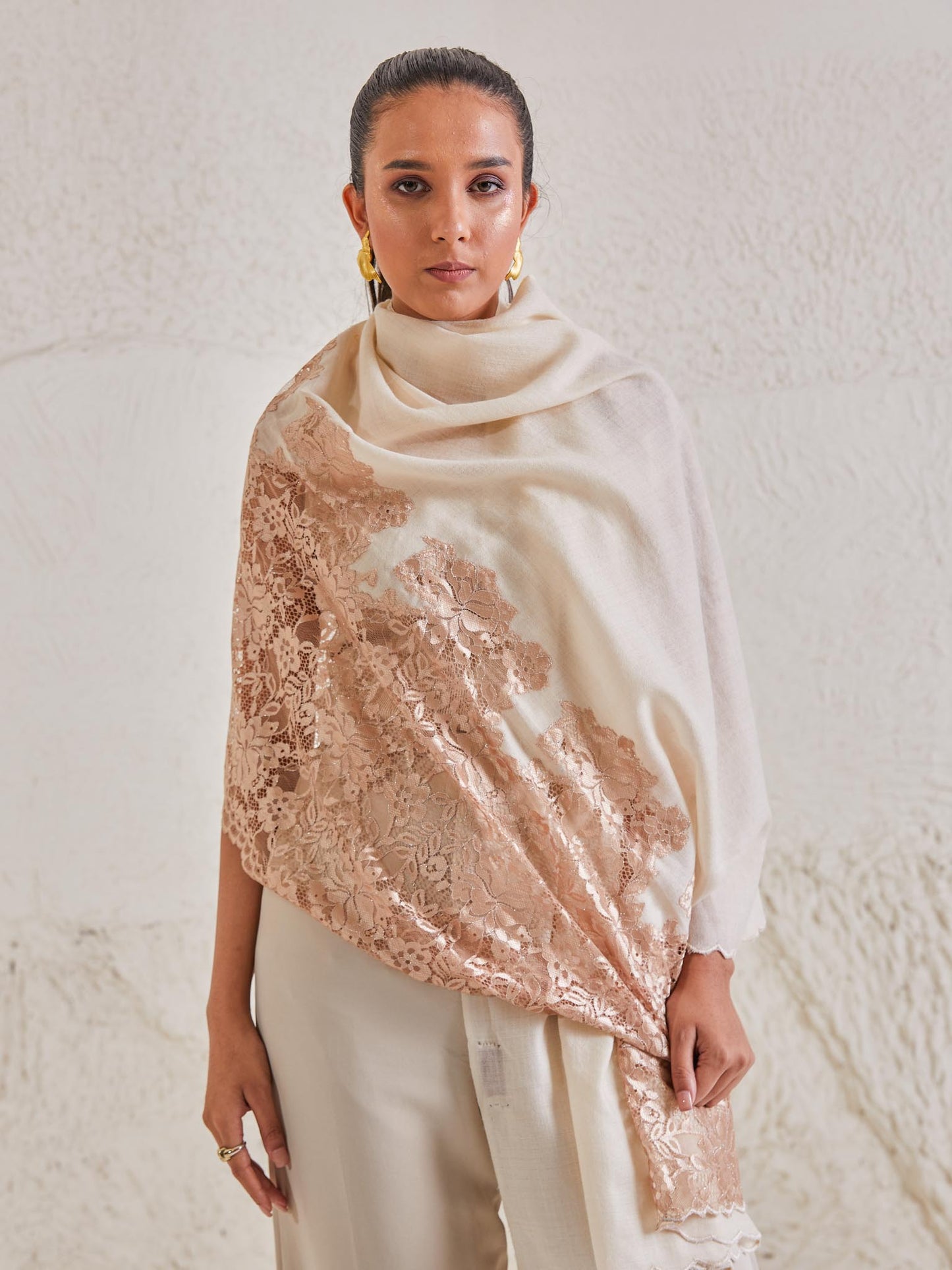 Model is wearing the Celestial Chantilly Pashmina Shawl in white and rose gold.