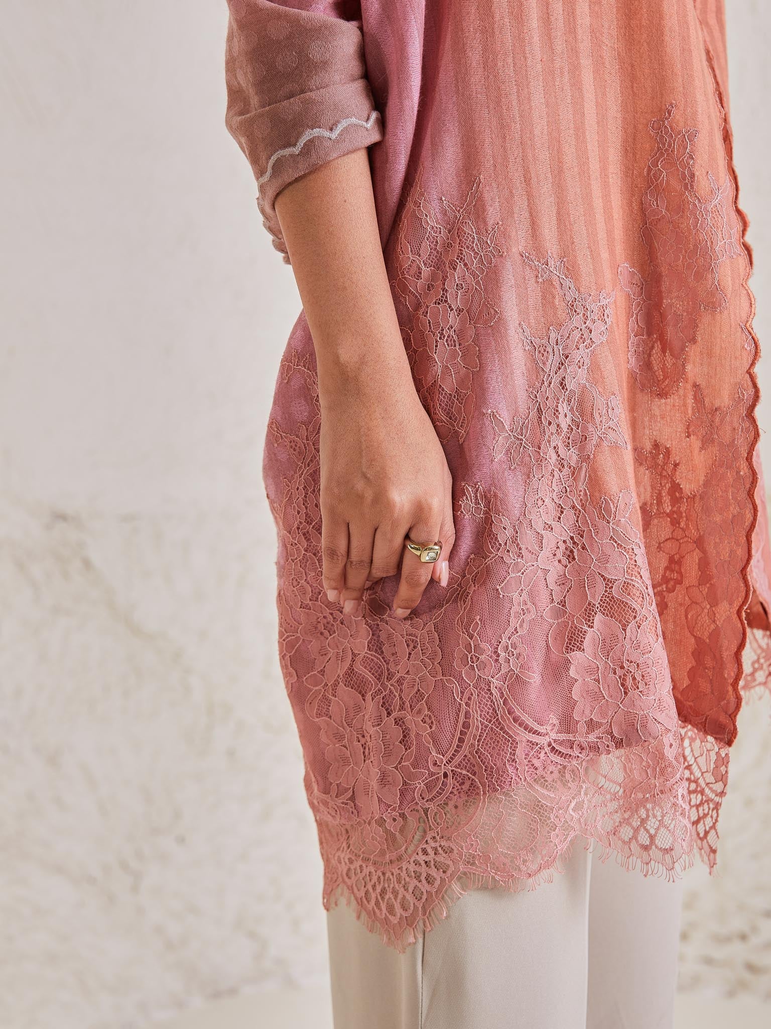 Model is wearing the Celestial Chantilly Pashmina Stole from shaza in baby pink and peach. 