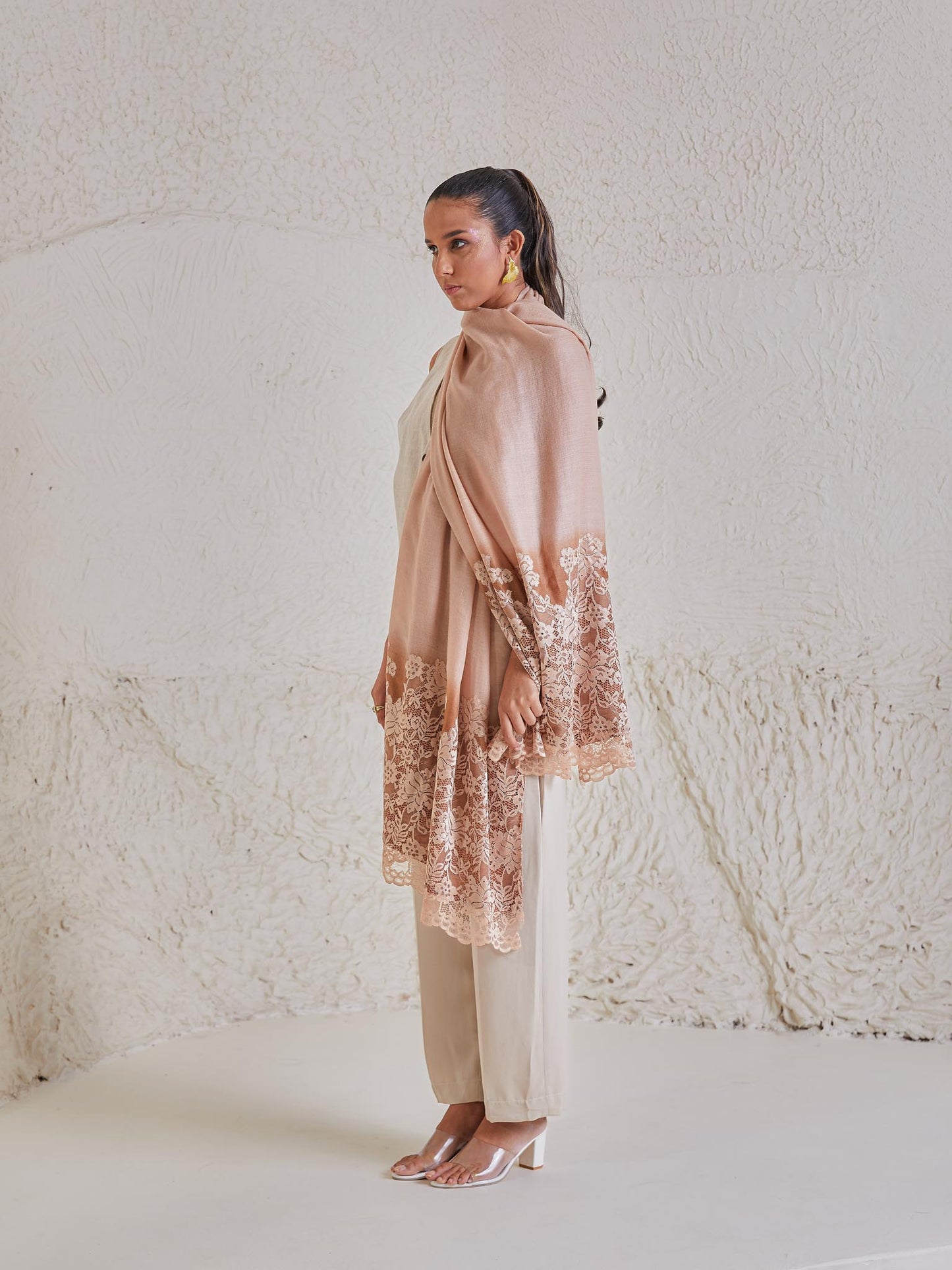 Model is wearing the Celestial Chantilly Pashmina Stole from shaza in gold-brown ombre.. 