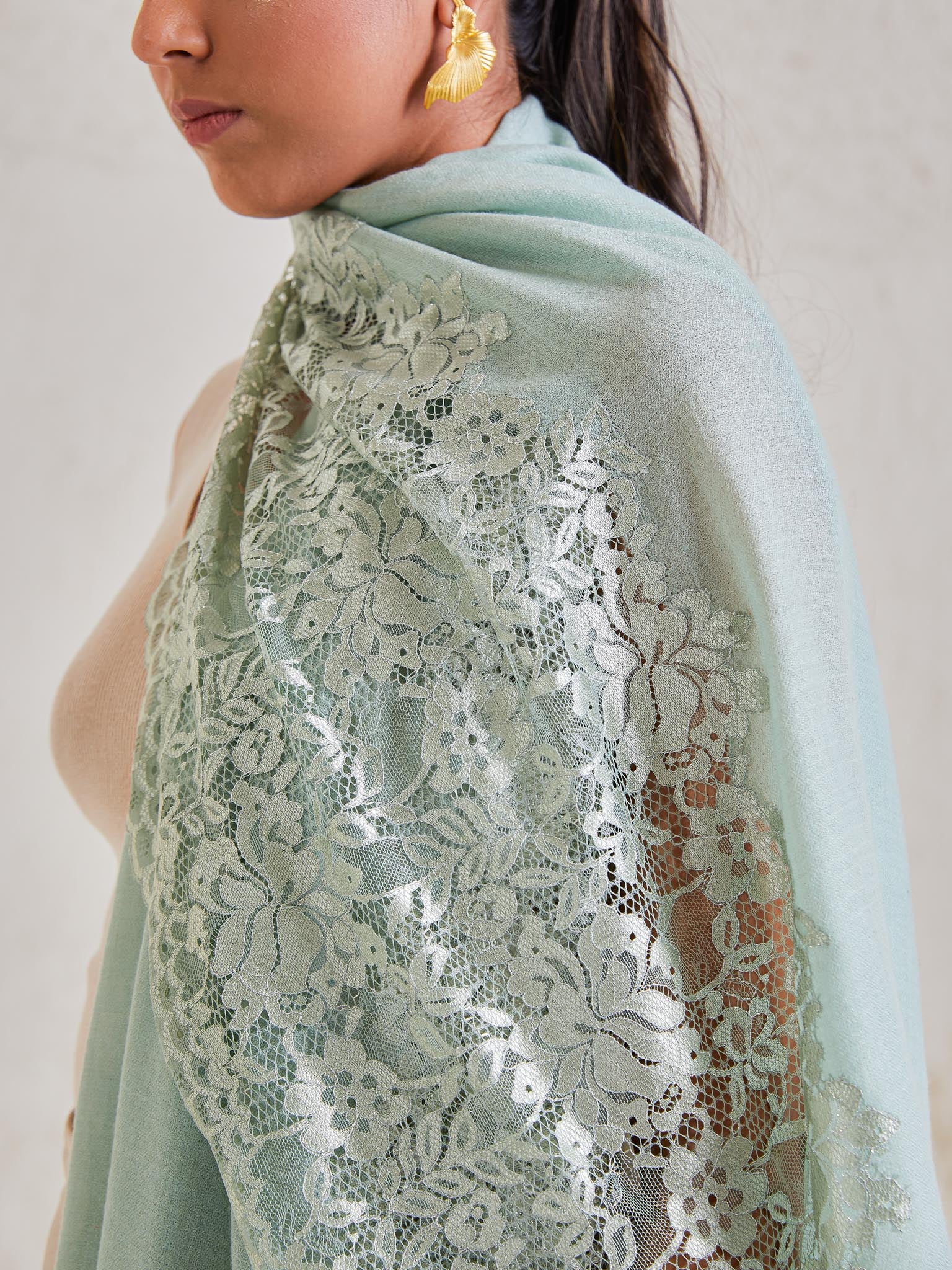 Model is wearing the Celestial Chantilly Pashmina Stole from shaza in sea green..