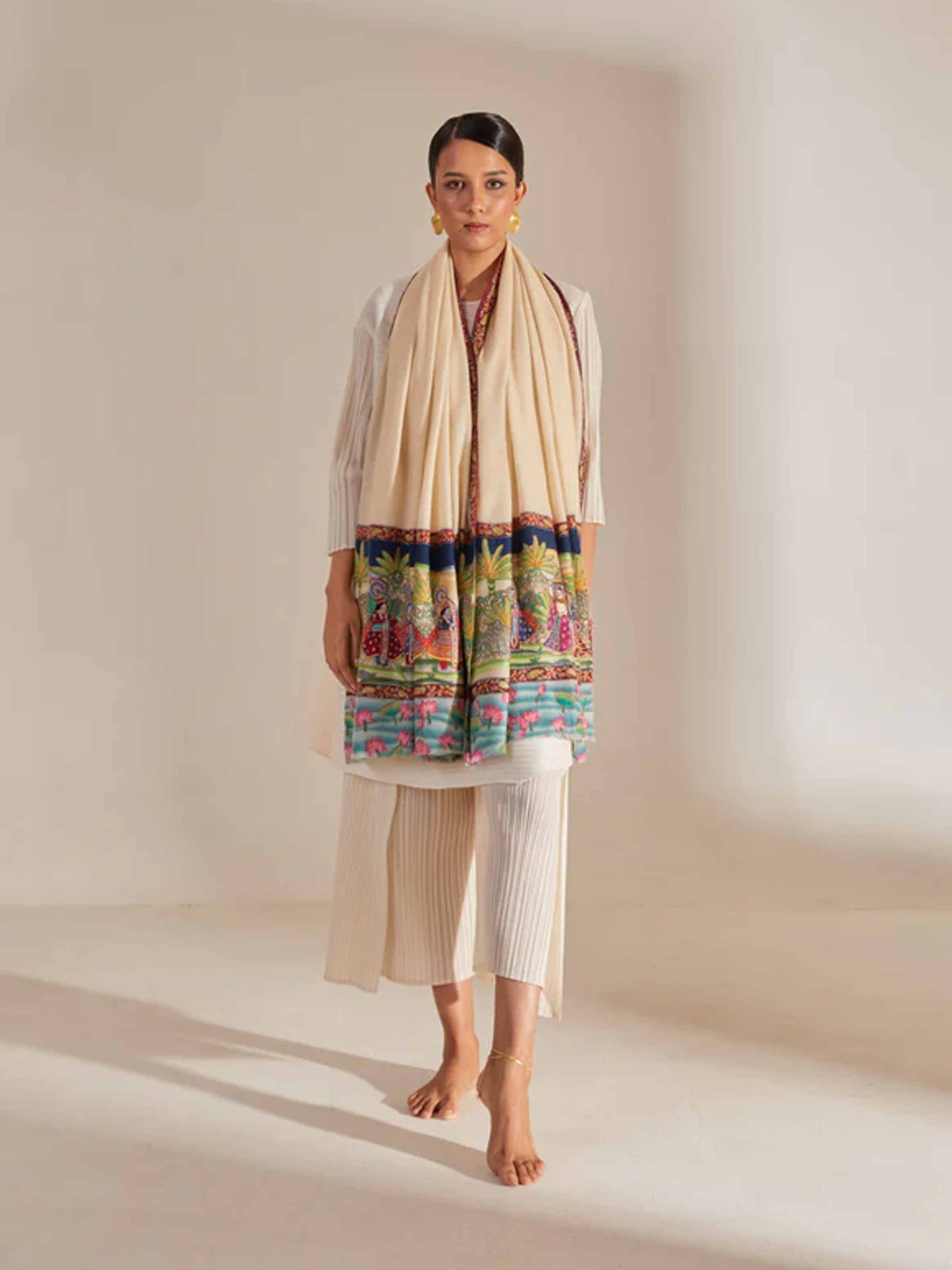Model is wearing the Krishna Barat Pashmina Kalamkari Stole  by Shaza, depicting the secret wedding of Lord Krishna and Radha, solemnized by Lord Brahma. 