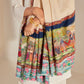 Model is wearing the Krishna Baraat Pashmina Shawl hand painted and hand embroidered on handloomed pashmina, depicting the secret wedding of Radha and Krishna, presided over by Lord Brahma. 