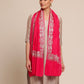 Woman wearing a bright pink woolen stole
