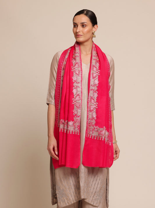 Woman wearing a bright pink woolen stole