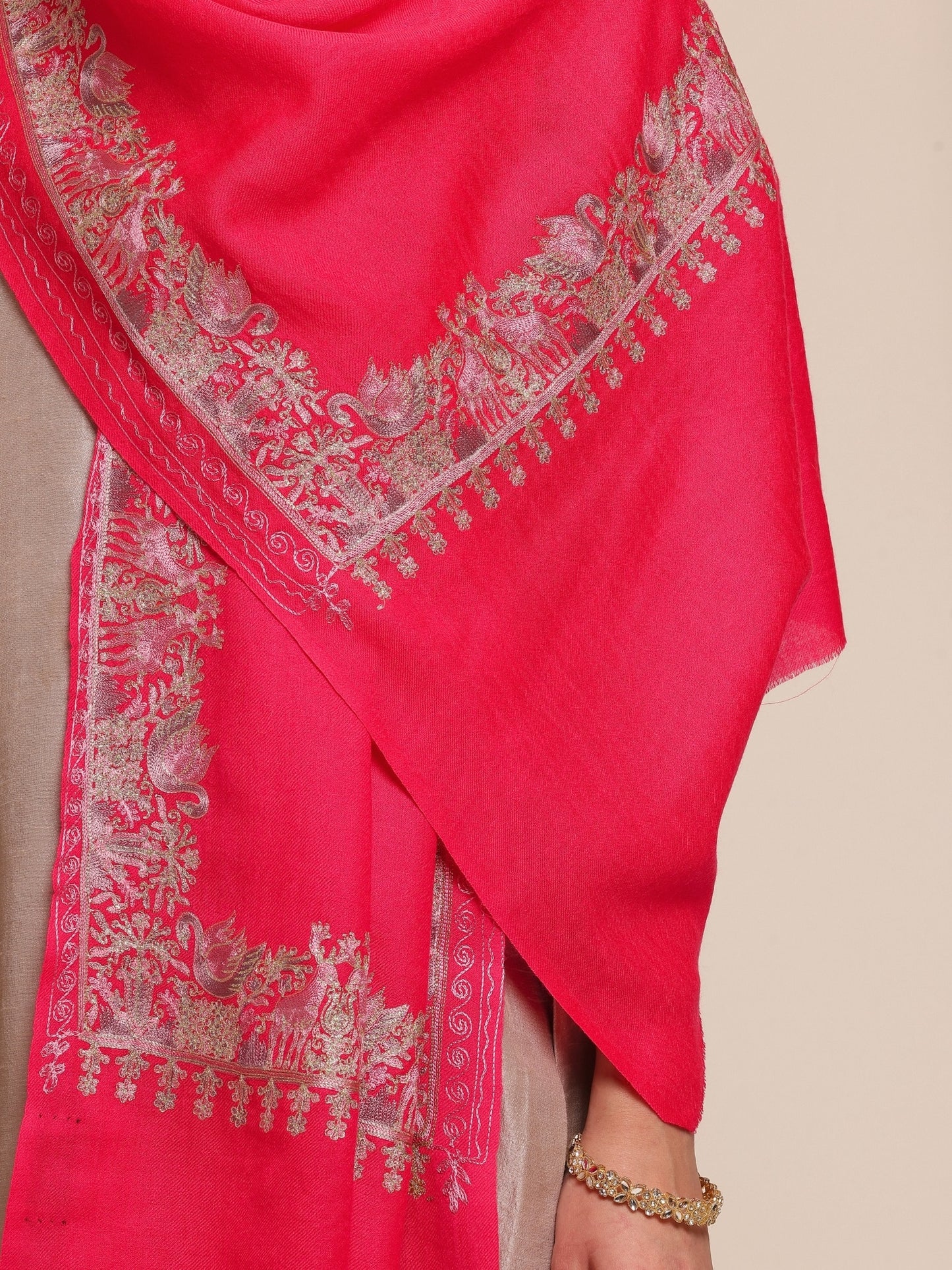 Woman wearing a bright pink woolen stole