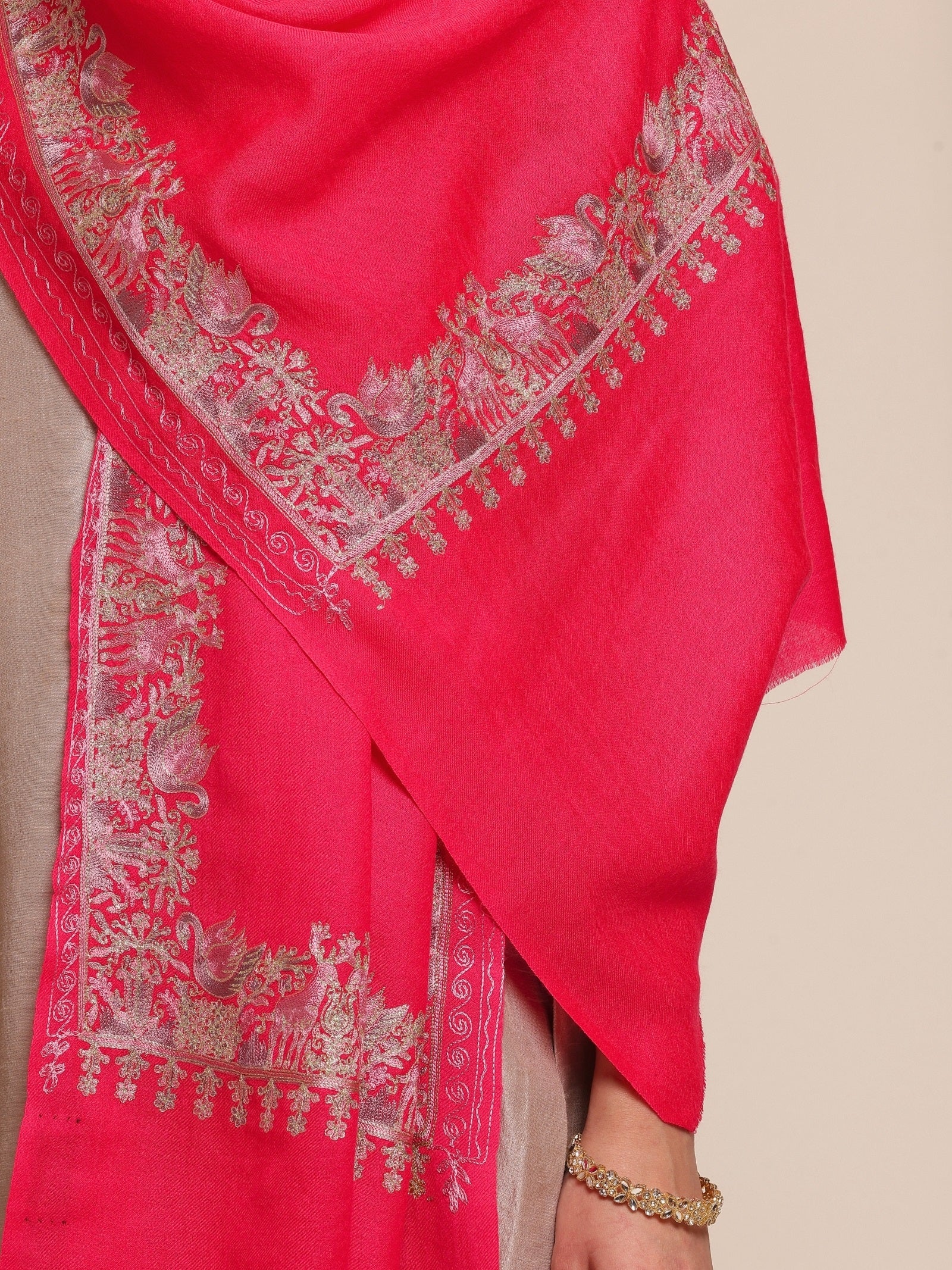 Woman wearing a bright pink woolen stole