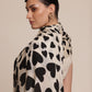 Woman wearing a black and white Heart patterned Stole