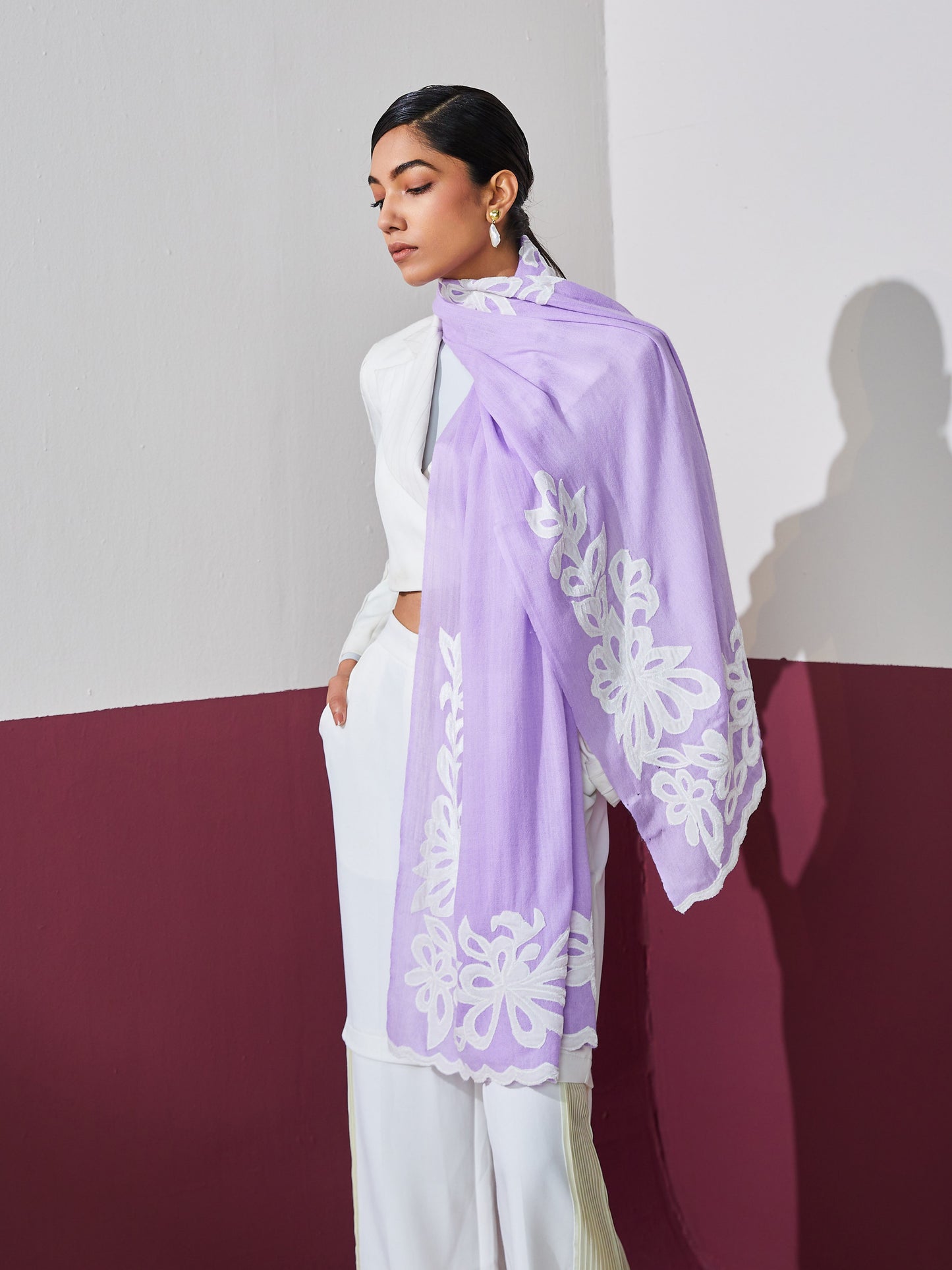 Model is wearing a lavender Velvet affair cashmere stole with white applique from Shaza.