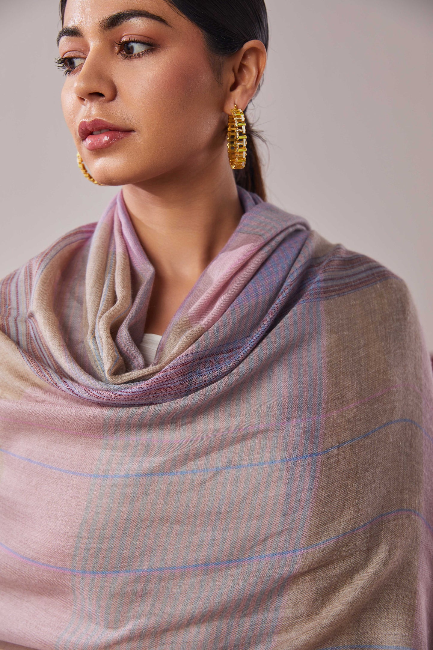 Model is wearing a pashmina striped stole from Shaza.