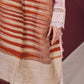 Model is wearing an Ekkat reversible stole in maroon from Shaza.