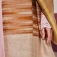 Model is wearing an Ekkat reversible stole in ochre from Shaza.