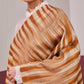 Model is wearing an Ekkat reversible stole in ochre from Shaza.