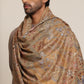 Man wearing beige pashmina shawl