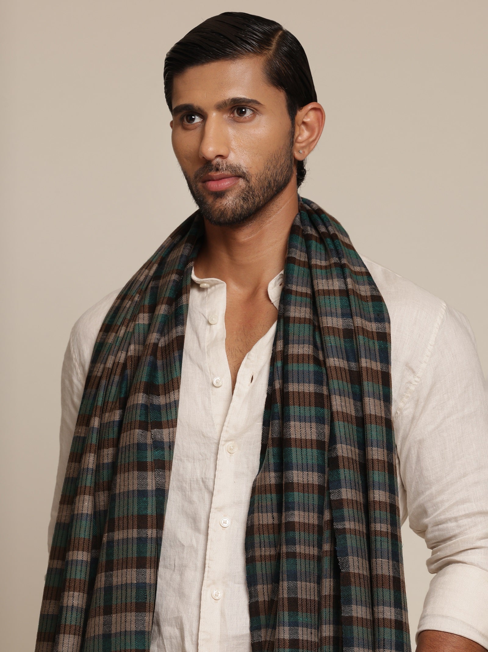 Man wearing a check stole