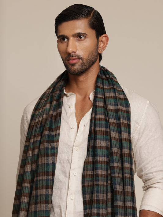 Man wearing a check stole