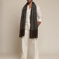 Man wearing a check stole