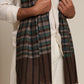 Man wearing a check stole