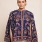 Woman wearing a floral-patterned navy blue jacket