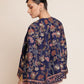 Woman wearing a floral-patterned navy blue jacket