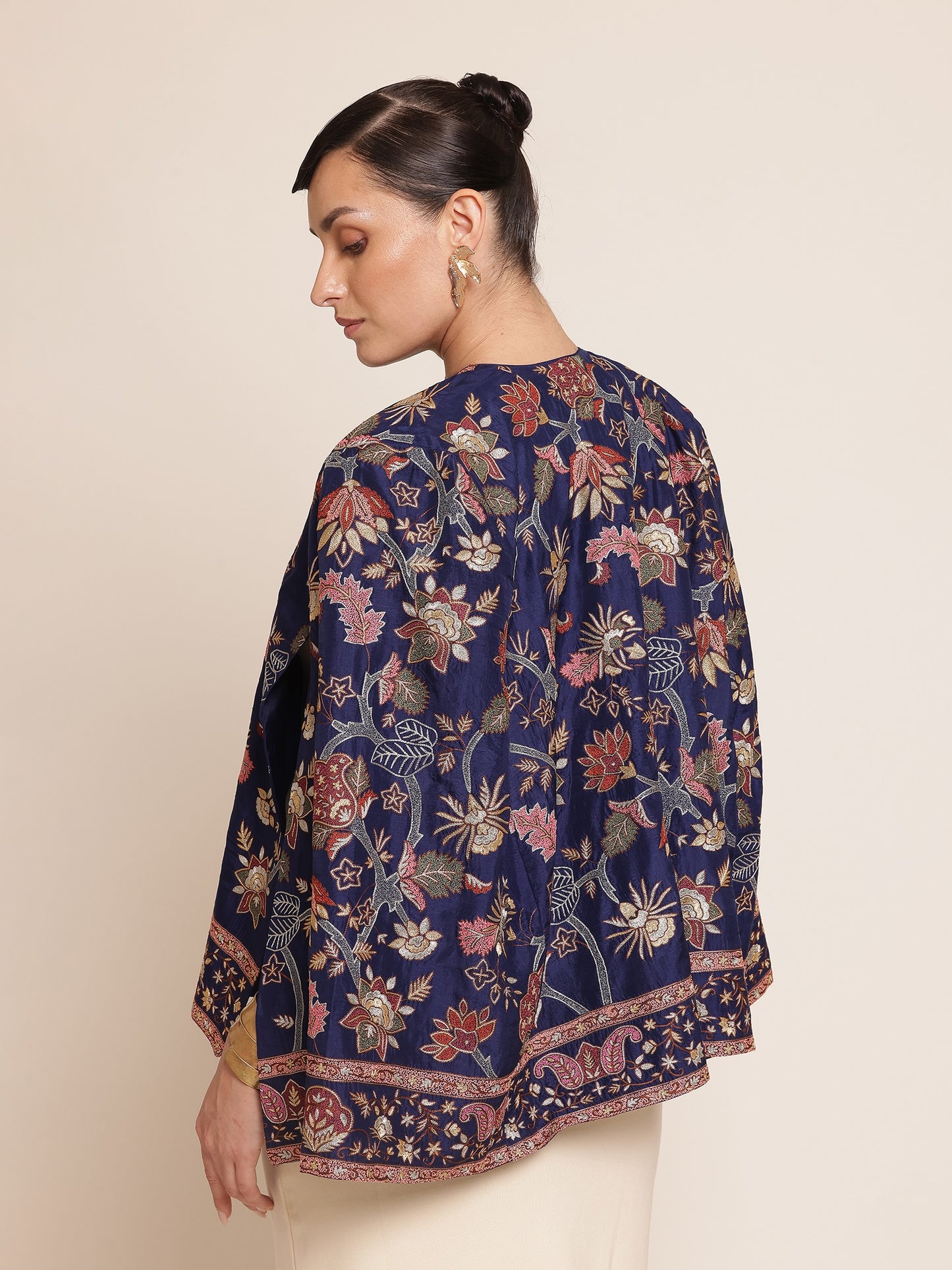 Woman wearing a floral-patterned navy blue jacket