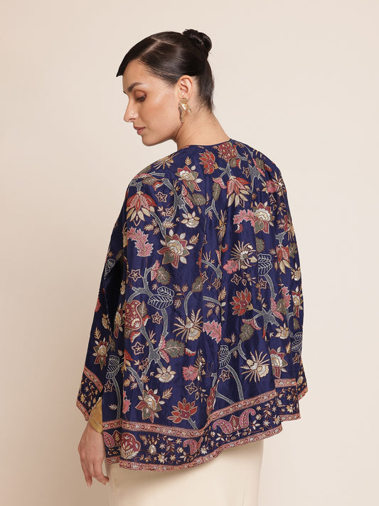 Woman wearing a floral-patterned navy blue jacket