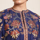 Woman wearing a floral-patterned navy blue jacket