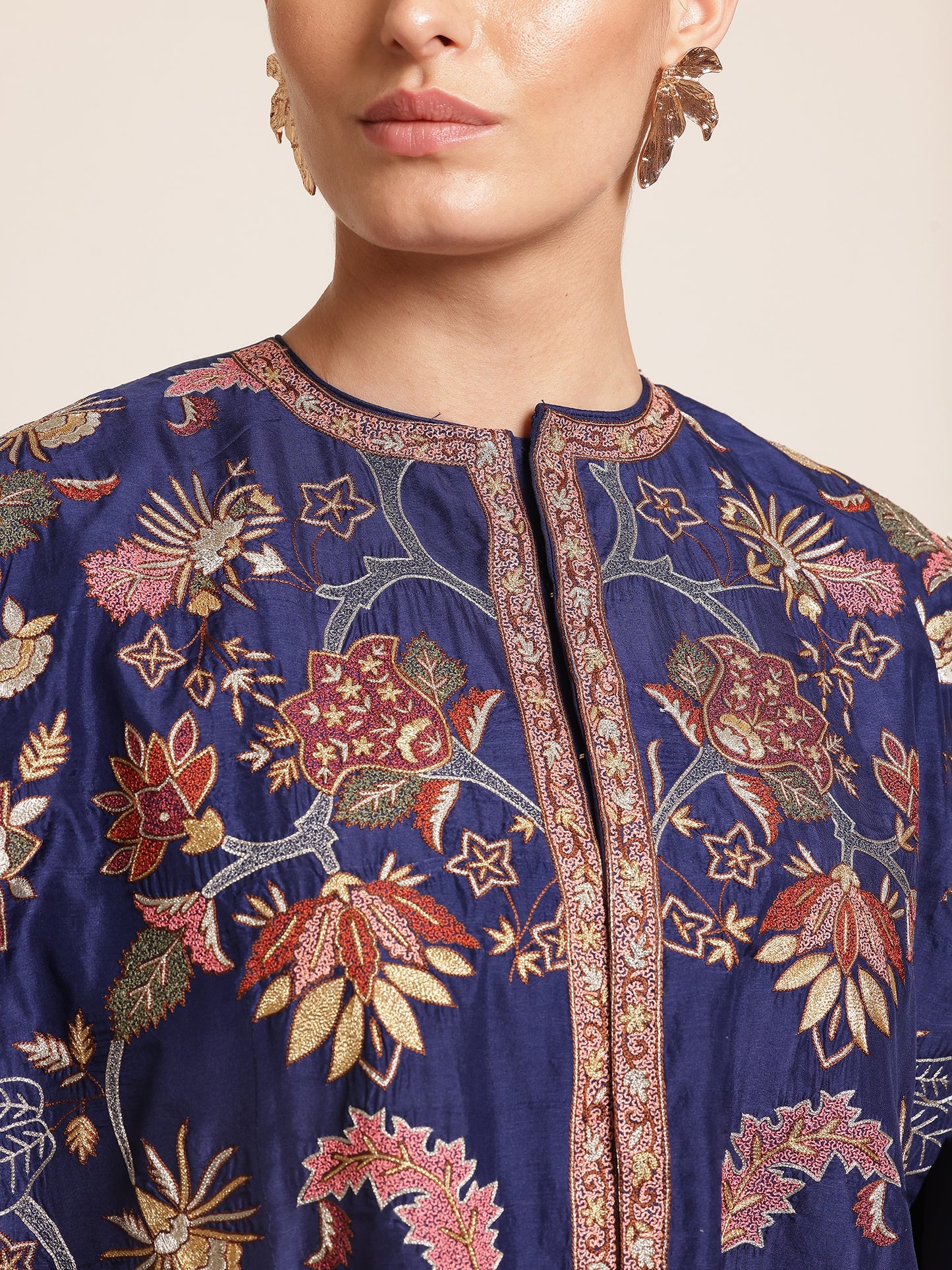 Woman wearing a floral-patterned navy blue jacket