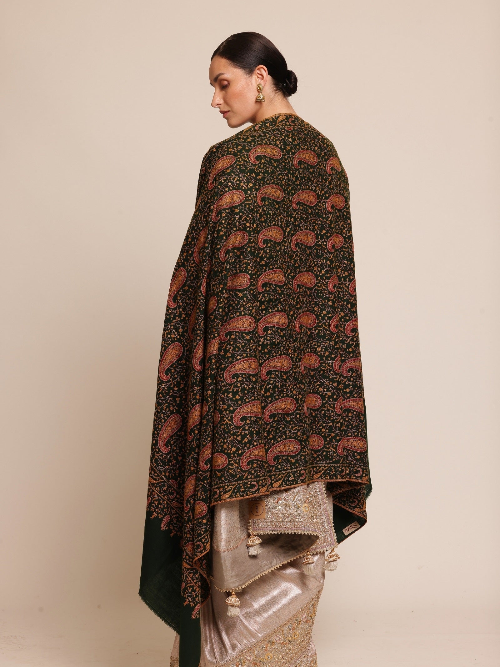 Woman wearing a green pashmina shawl