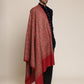 Man wearing a red patterned kalamkari shawl
