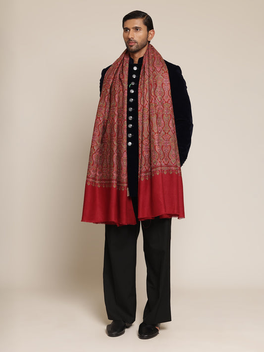 Man wearing a red patterned kalamkari shawl