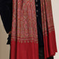 Man wearing a red patterned kalamkari shawl