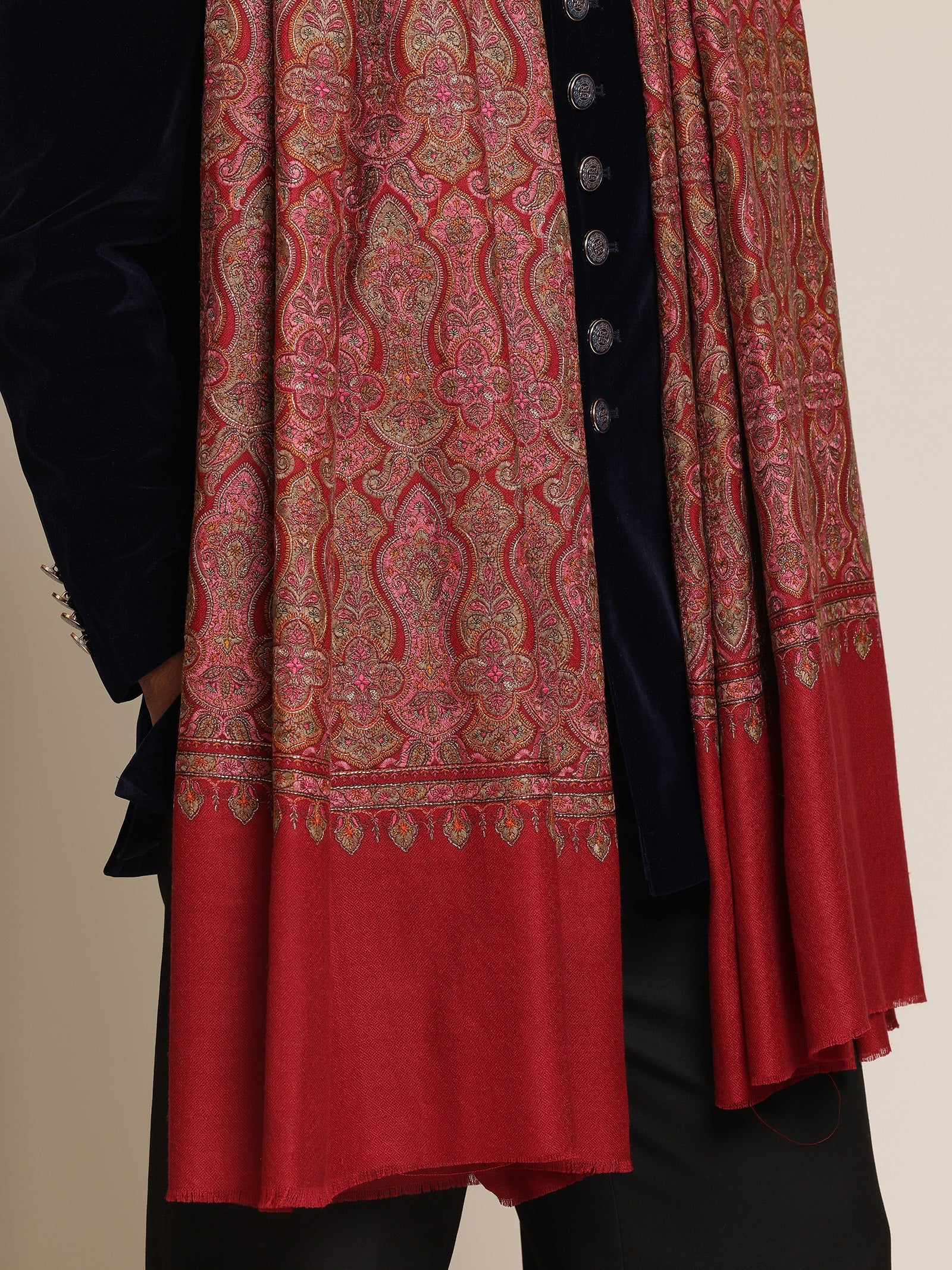 Man wearing a red patterned kalamkari shawl
