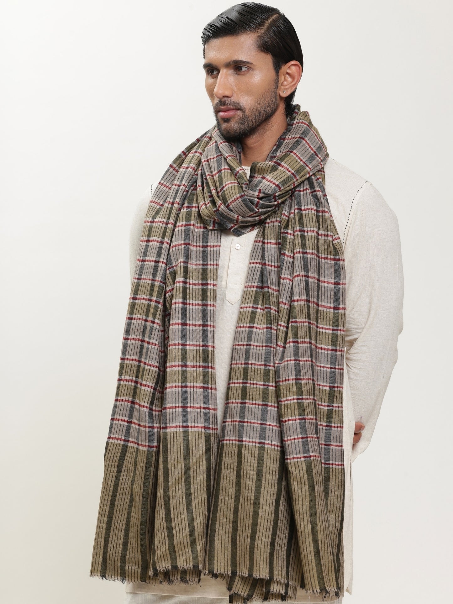 Man wearing a check shawl