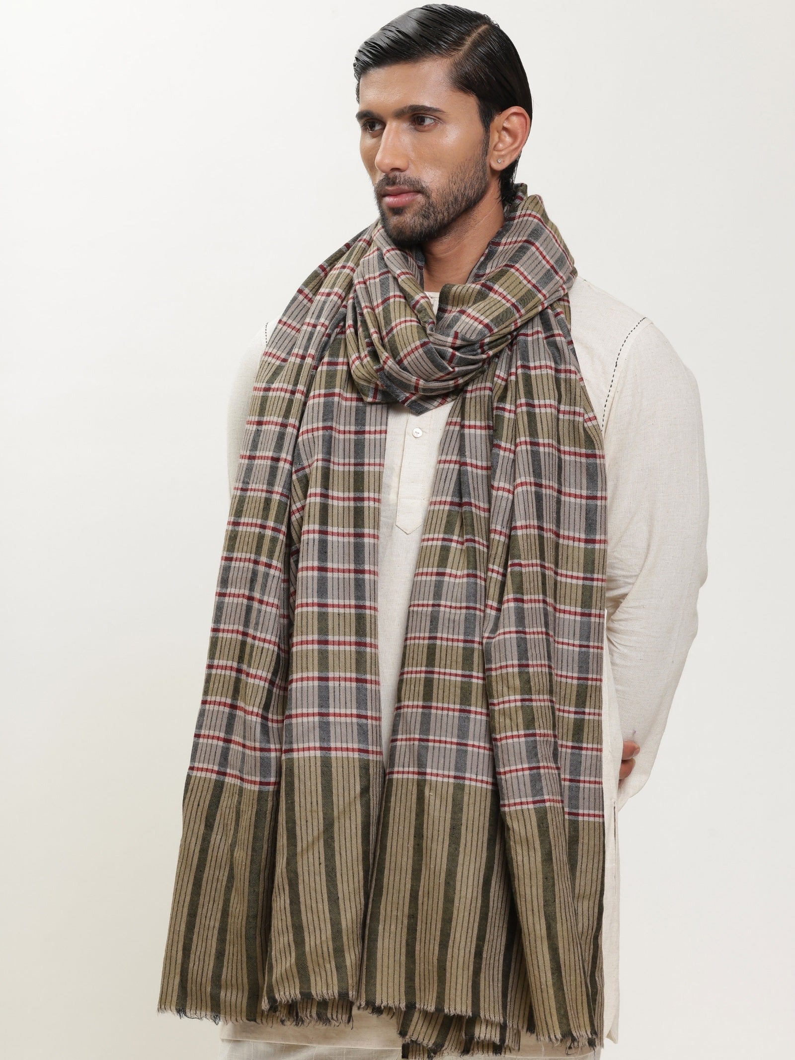 Man wearing a check shawl