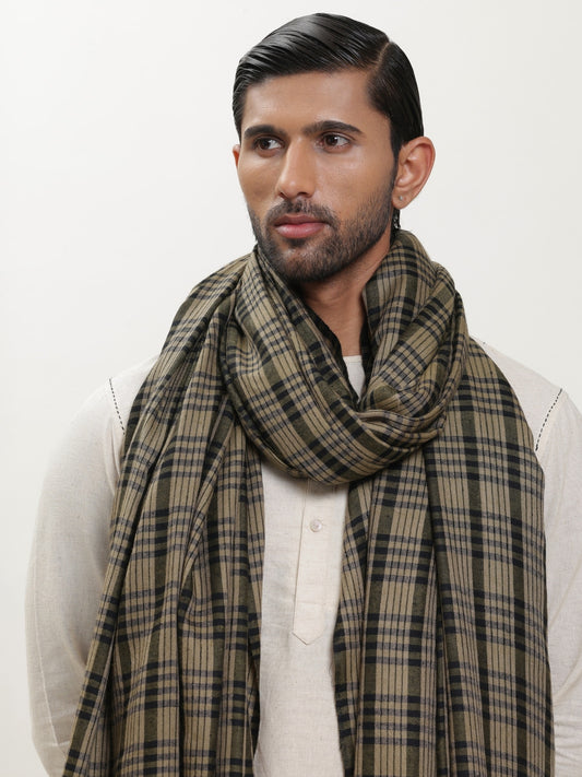 Man wearing a check shawl