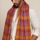 Man wearing a check shawl