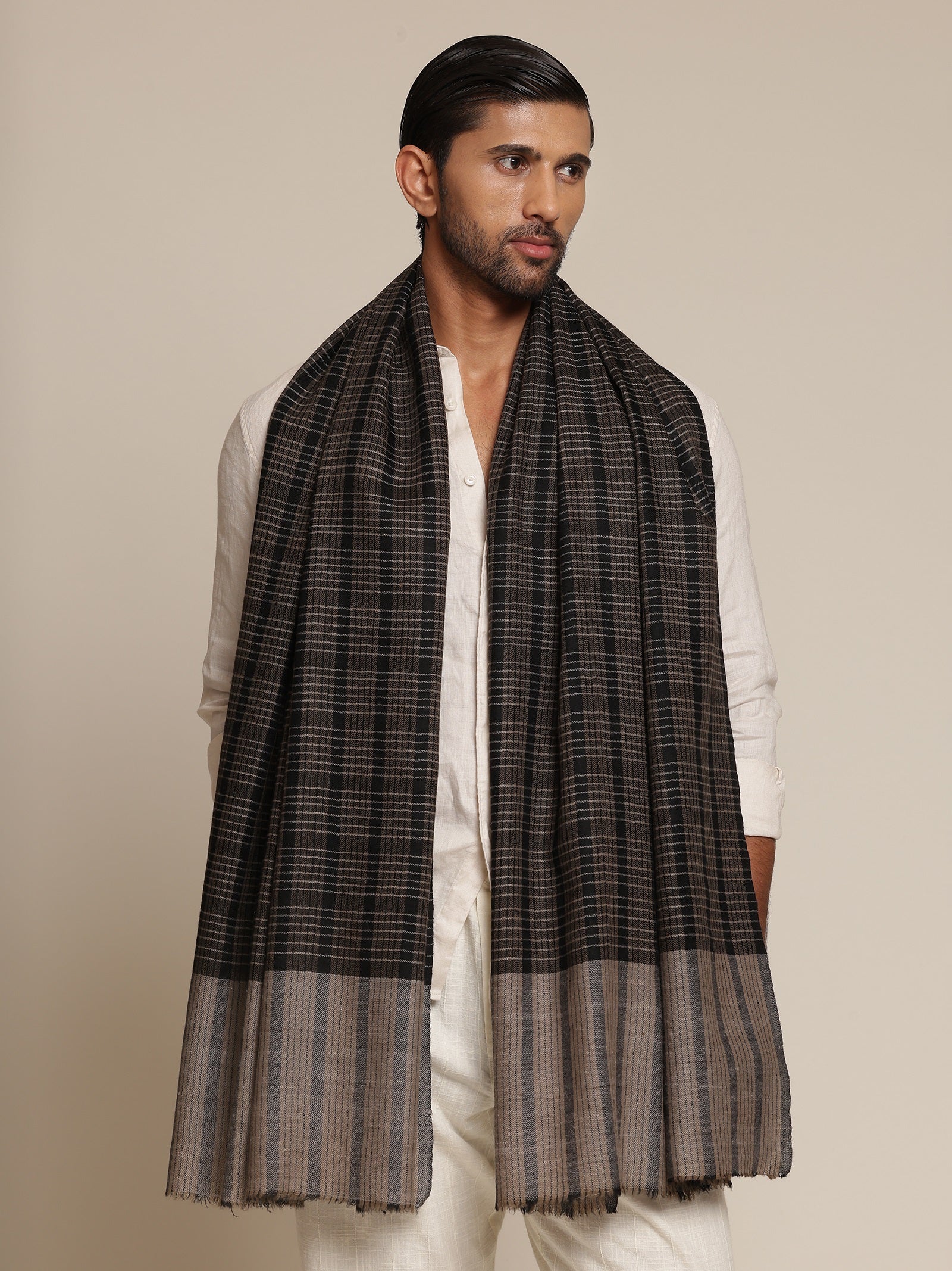 Man wearing a black and gray check stole