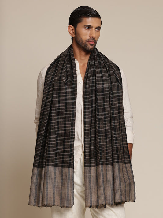 Man wearing a black and gray check stole