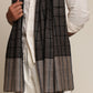 Man wearing a black and gray check stole