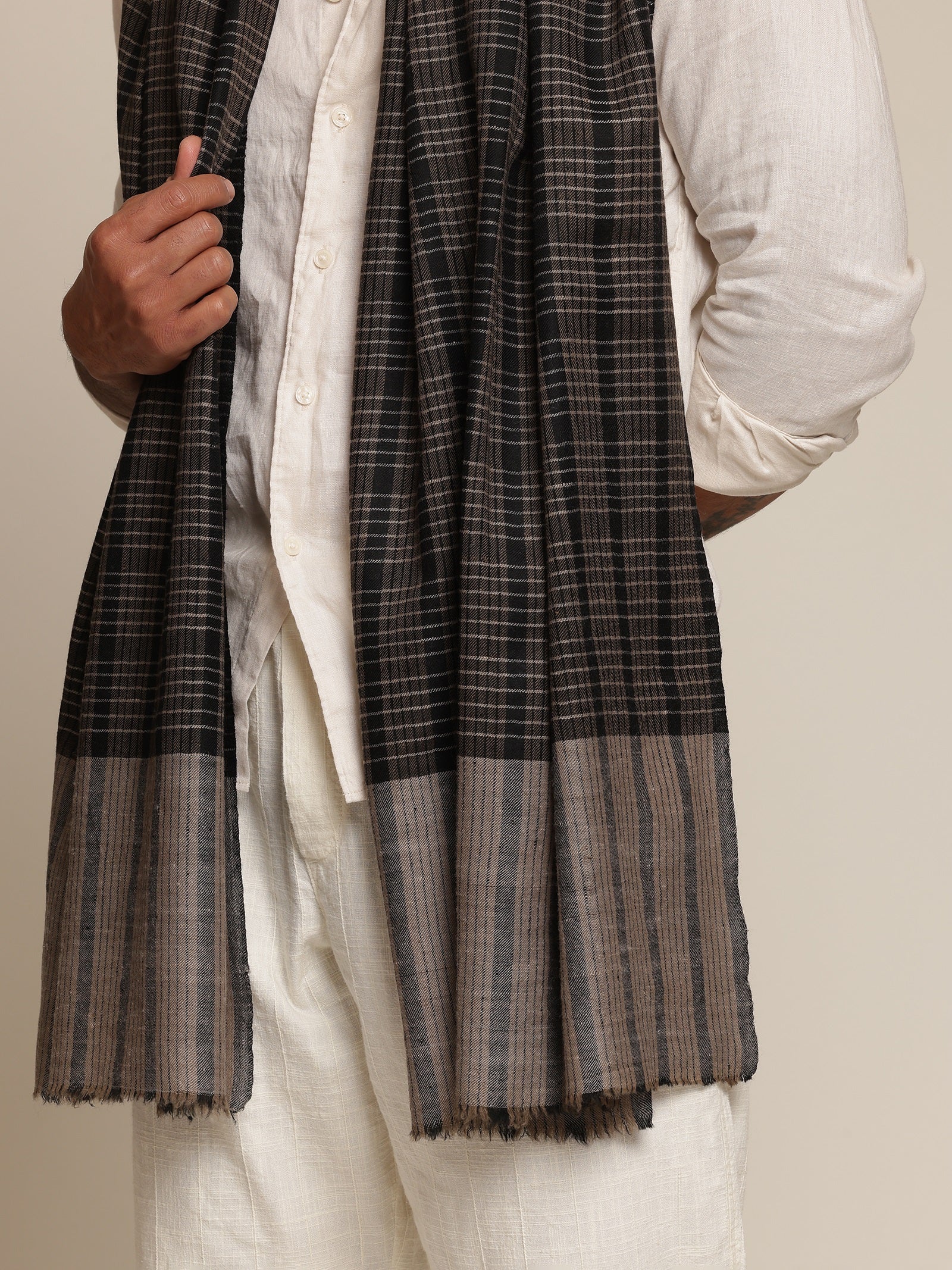 Man wearing a black and gray check stole