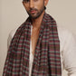 Man wearing a check stole