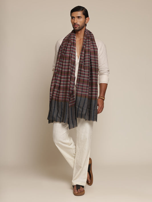 Man wearing a check stole
