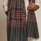 Man wearing a check stole