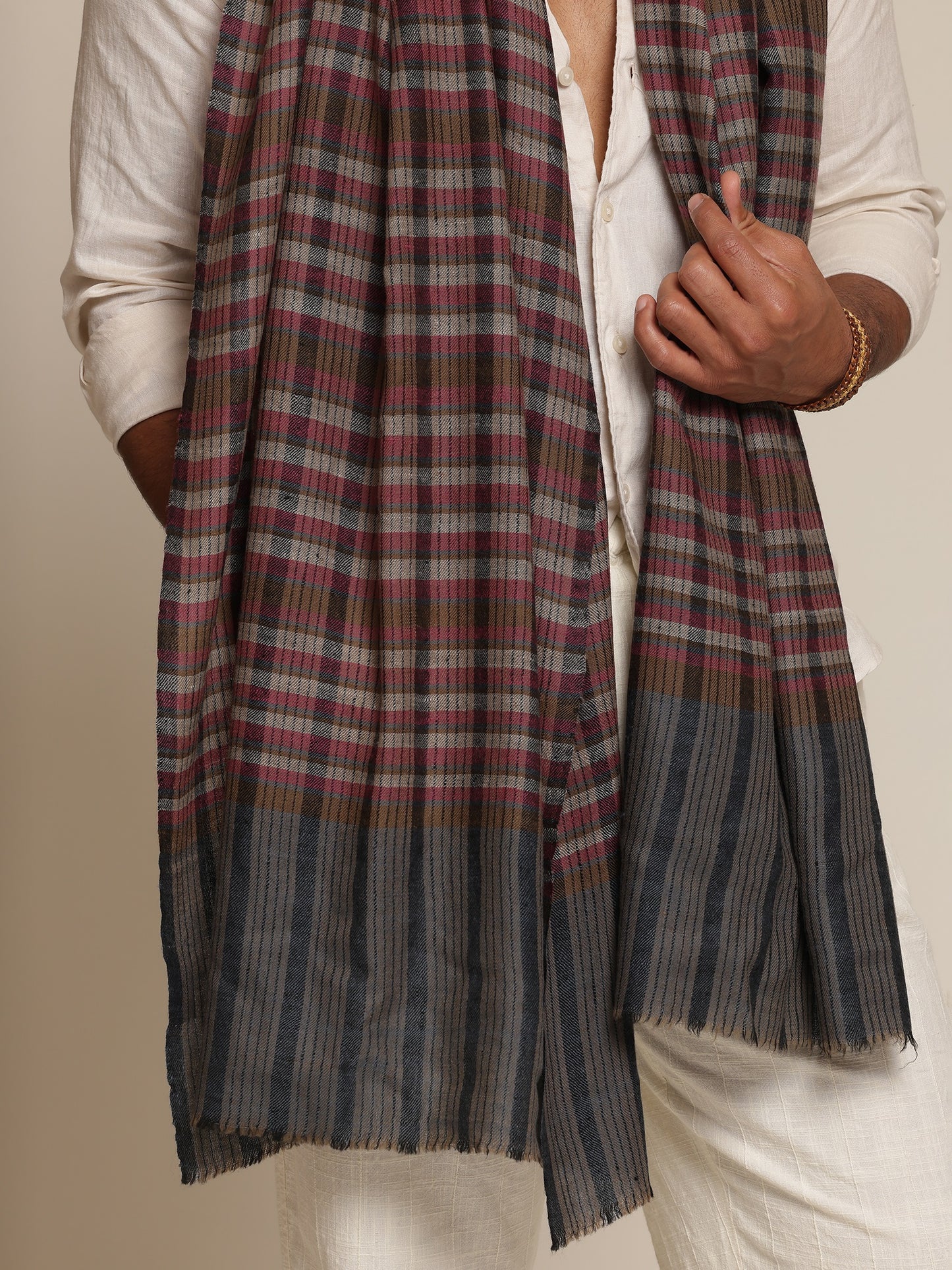 Man wearing a check stole