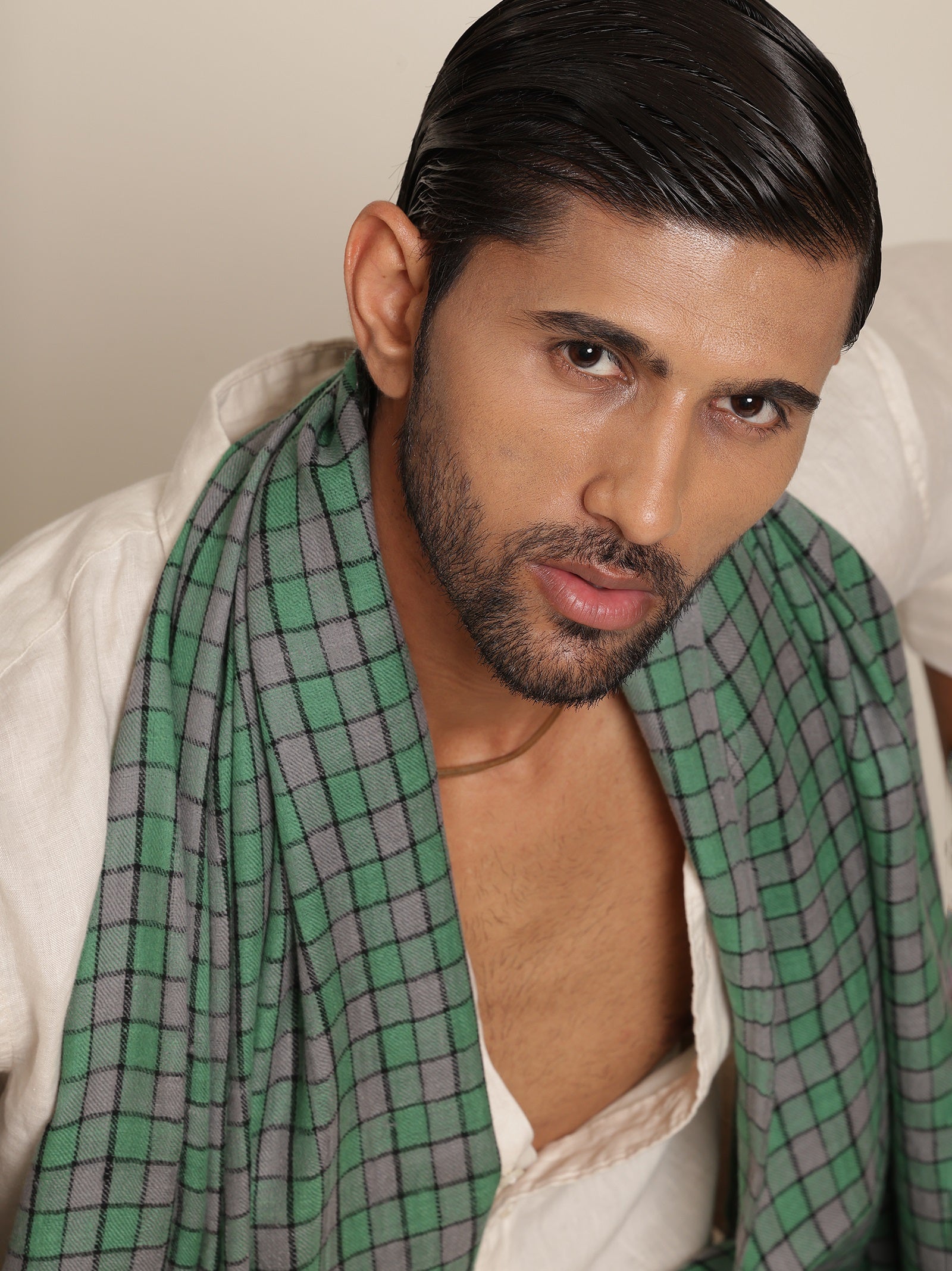 Man wearing a green pashmina stole