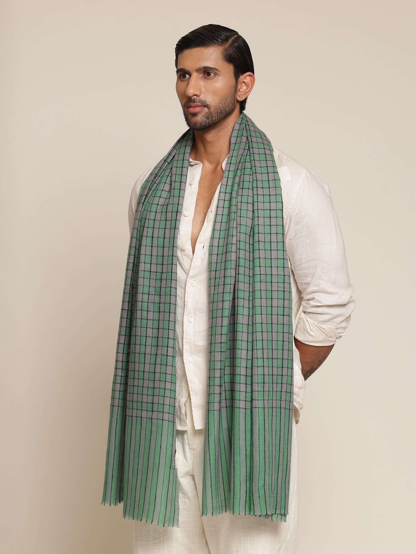 Man wearing a green pashmina stole